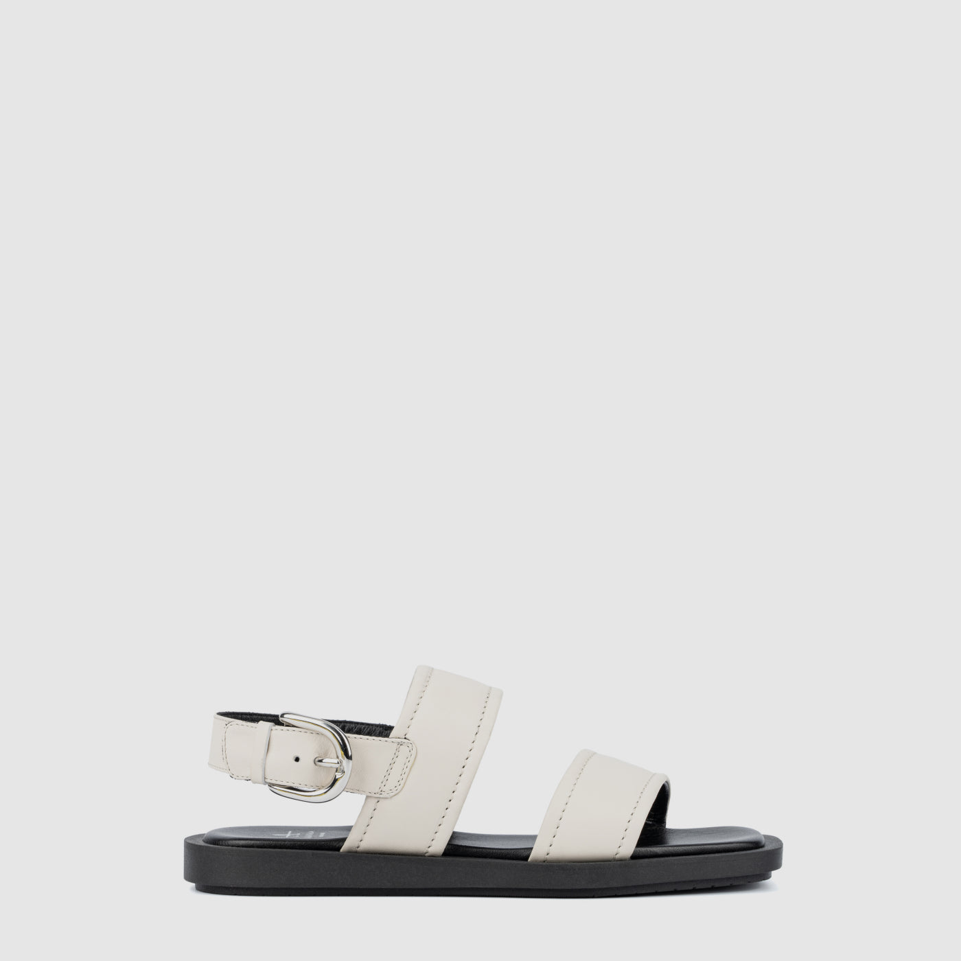 Joni sandal in eggshell suede with an adjustable buckle