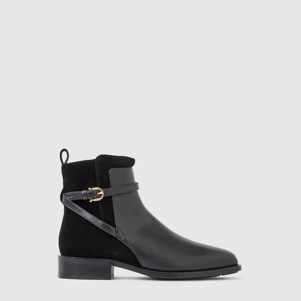 Nettie ankle boot in black leather with a criss-cross buckle